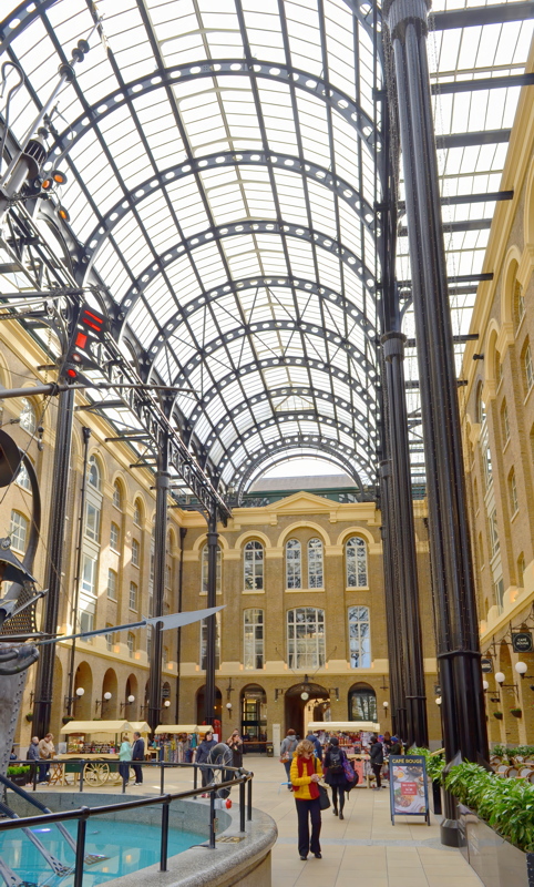 22 - The soaring glass-and-iron vaulted roof inside Hay's Galleria on the South Bank of the River Thames in London
